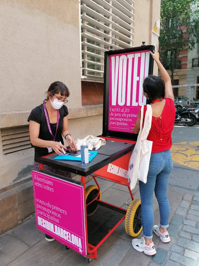 Promoters preparing a stand of information about voting